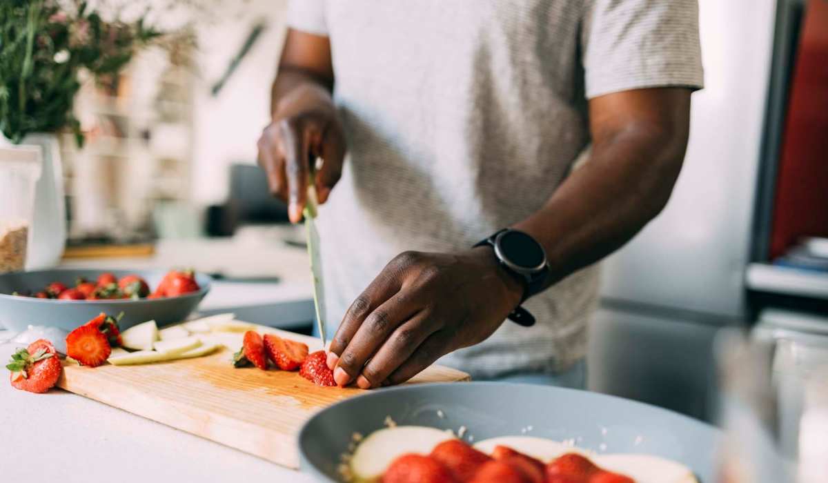 A resident preparing a meal in his kitchen at Copper Range in Colorado Springs, Colorado