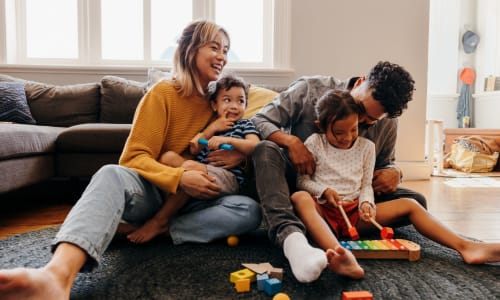 Family in their living room at Amador Heights in Concord, California