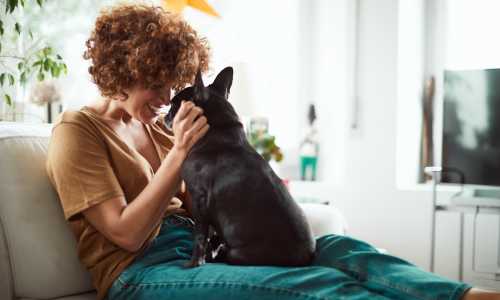 Resident playing with her dog at Vivo Living Summerville in Summerville, South Carolina