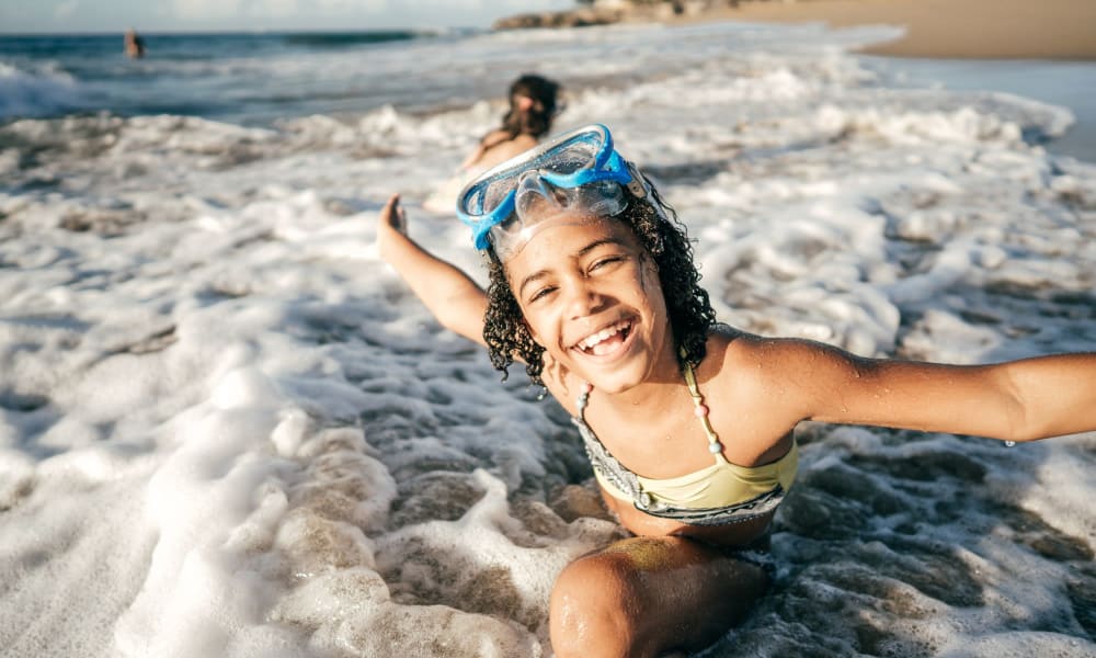 Resident child enjoying the beach near The Cove in Fort Walton Beach, Florida