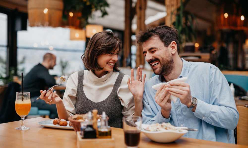 Resident enjoying food at a restaurant near Integra 289 Exchange in DeBary, Florida