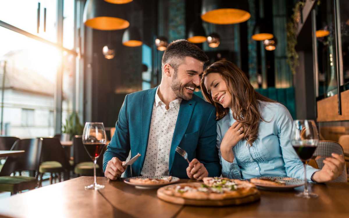 Couple having food in local restaurant near Magnolia Terrace in Tallahassee, Florida