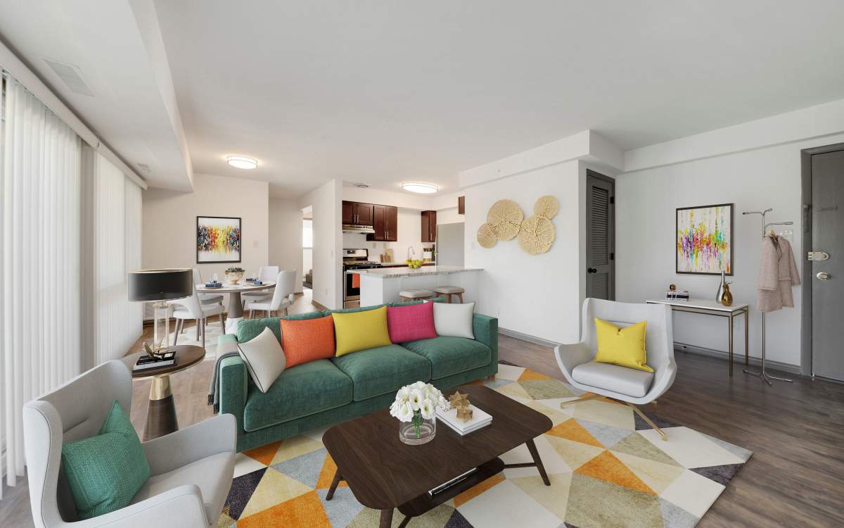 Spacious living room with wood-style flooring at Parkside Landing Apartments in Rockville, Maryland