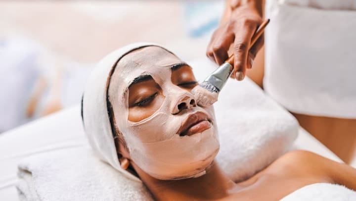 A woman getting a facial at a spa | spas in Peoria