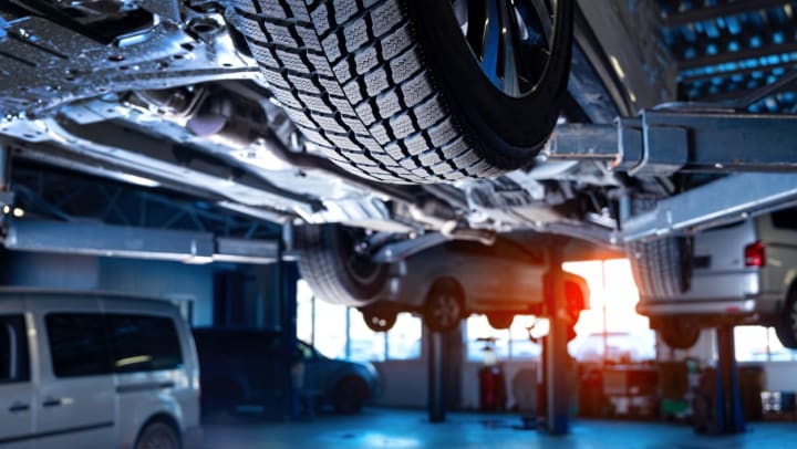 Cars on lifts at an auto service center | Auto Repair Shops Around Willow Park