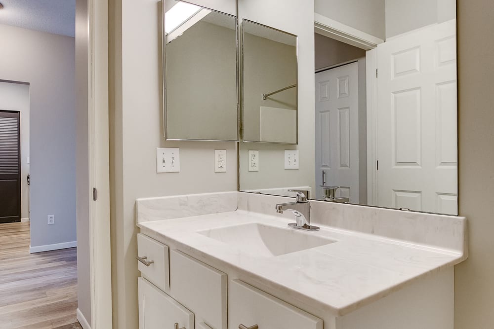 A bathroom with modern cabinetry at Provence Apartments in Burnsville, Minnesota