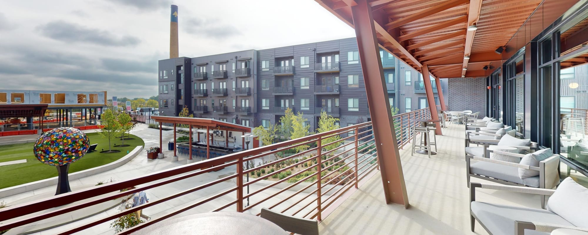 Leasing Office Balcony overlooking Central Green Park and One-Eyed Jacks Patio Bar at Factory 52 Apartments in Norwood, OH