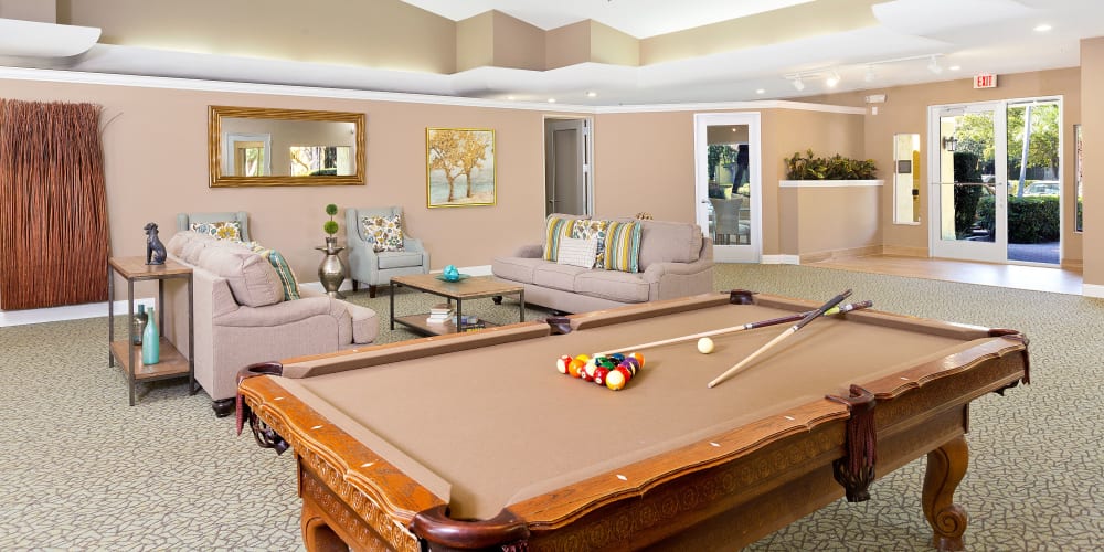 Clubhouse with pool table at Indian Hills Apartments in Boynton Beach, Florida