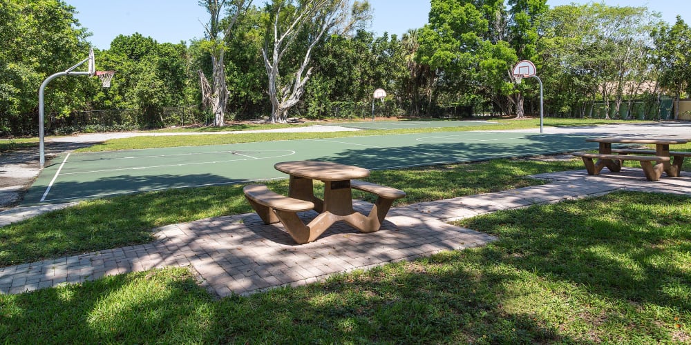 Basketball courts and picnic tables at Indian Hills Apartments in Boynton Beach, Florida