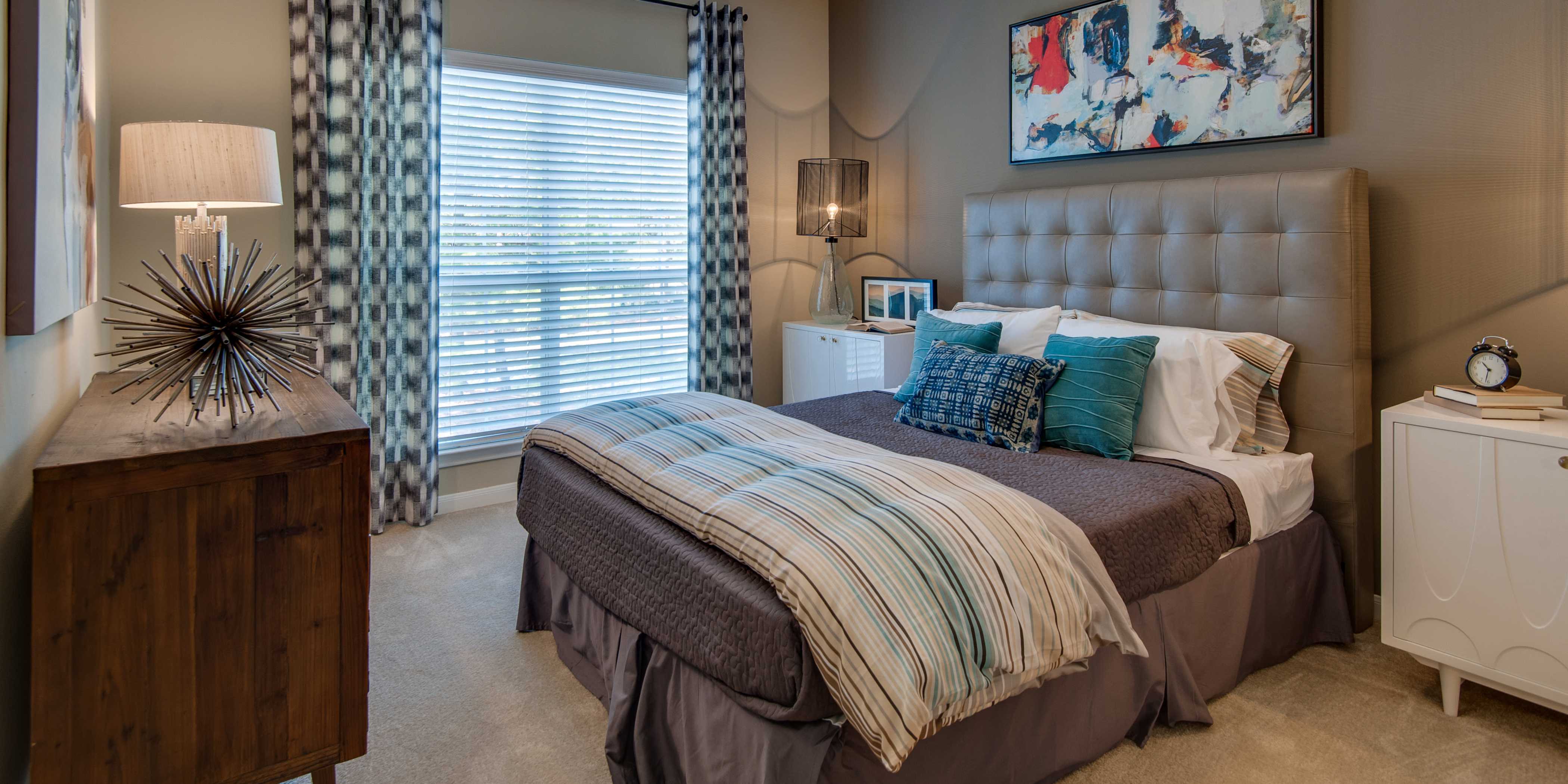 Master bedroom with a ceiling fan at Legacy at Meridian in Durham, North Carolina