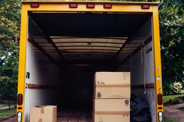A moving truck in front of a house near Northwest Mini Storage in Flushing, Michigan.
