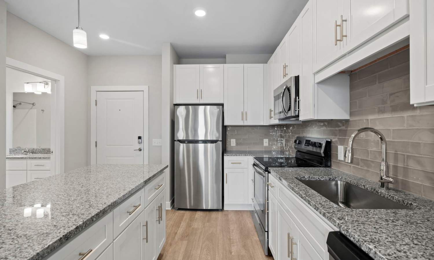 Modern kitchen with stainless-steel appliances at The Rise at Regency in Henrico, Virginia 