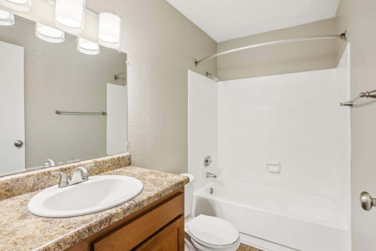 Resident bathroom with ample light at Casa De Fuentes in Overland Park, Kansas