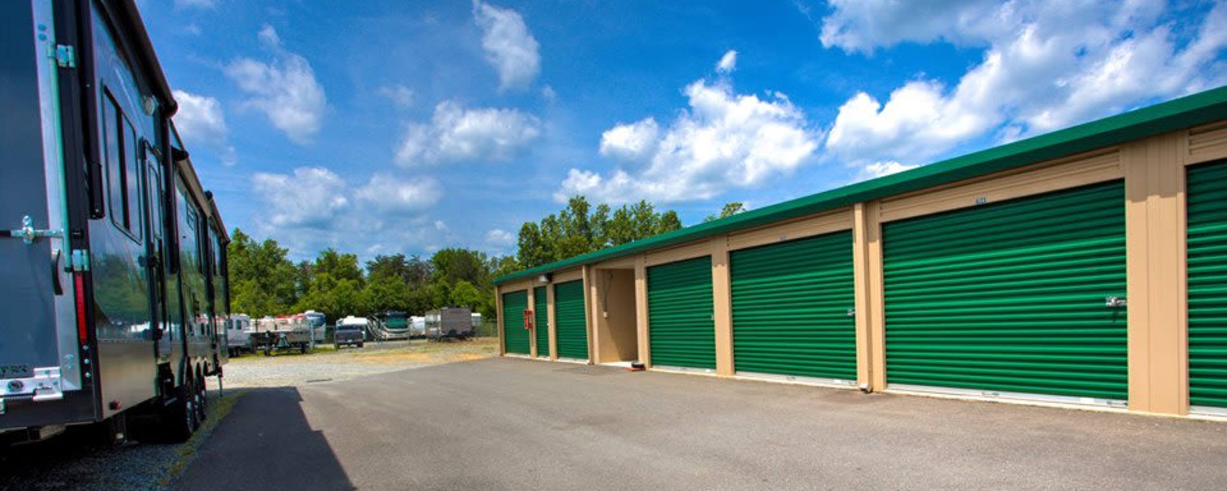 Outdoor units with a RV parked across from them at Falmouth Self Storage in Fredericksburg, Virginia