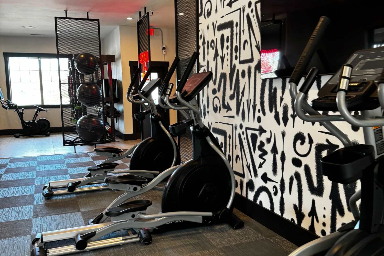 Community fitness center with plenty of cardio equipment at The Quarters at Lawrence in Lawrence, Kansas