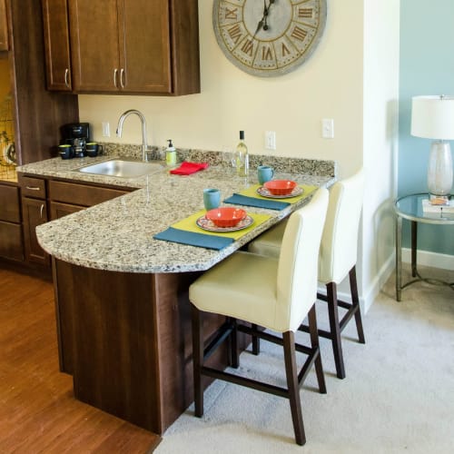 Kitchenettes with bar seating available at First & Main of Commerce Township in Commerce Township, Michigan