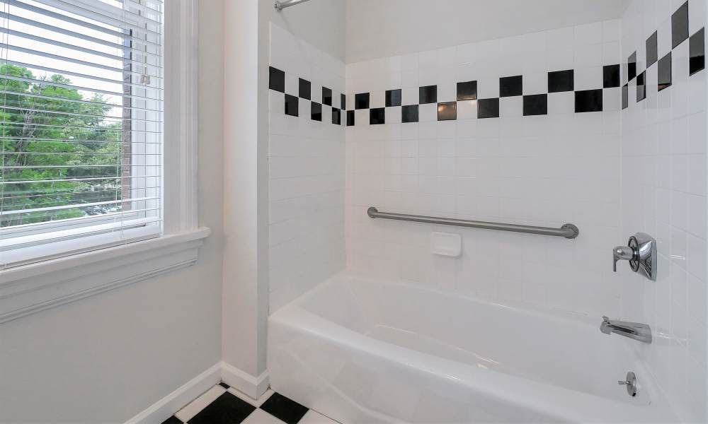 Bathroom with cool tile shower at The Grand Apartments in CHATTANOOGA, Tennessee