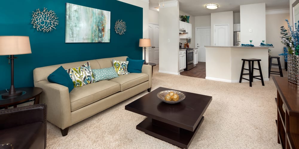 Modern living room with wood-style flooring at City Harbor in Melbourne, Florida