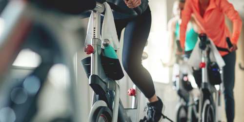 Residents cycling in the community fitness center at Bristol Bay in Tampa, Florida