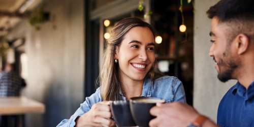 Couple enjoying their coffee time in a cafe near Kernwood Terrace in Los Angeles, California