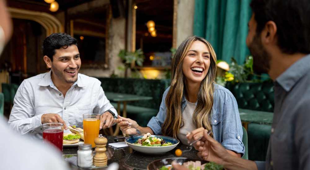 Resident friends having food near Georgia West in Silver Spring, Maryland