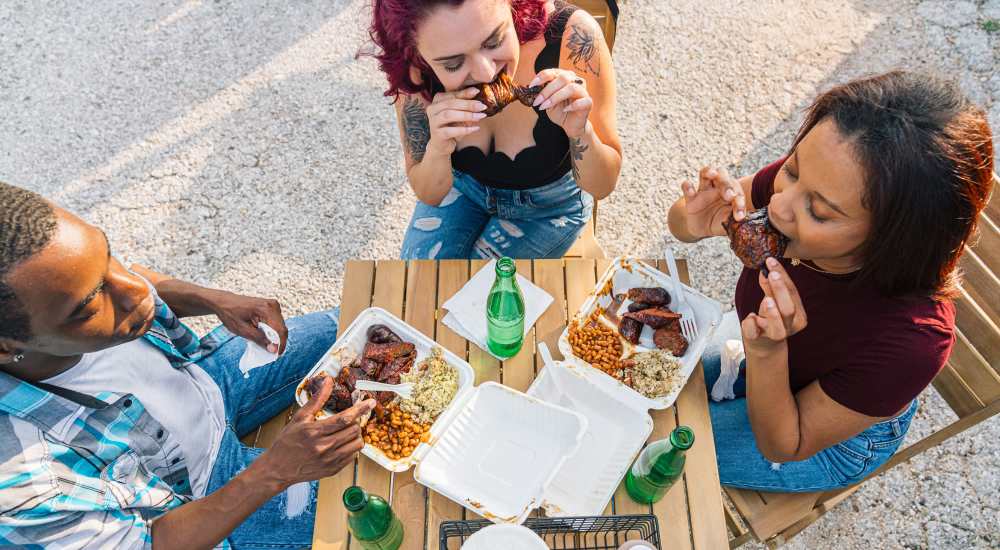 Residents eating food their favorite restaurent  near Barcelo Apartment Homes in San Antonio, Texas
