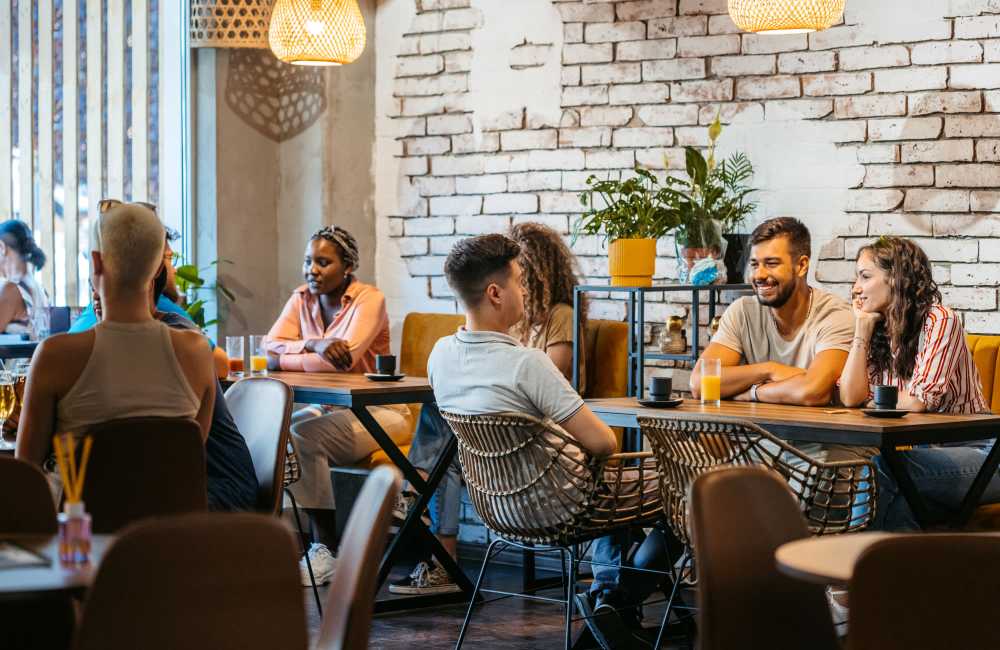 Resident spending quality time in café near Edge at Town Center in Jacksonville, Florida