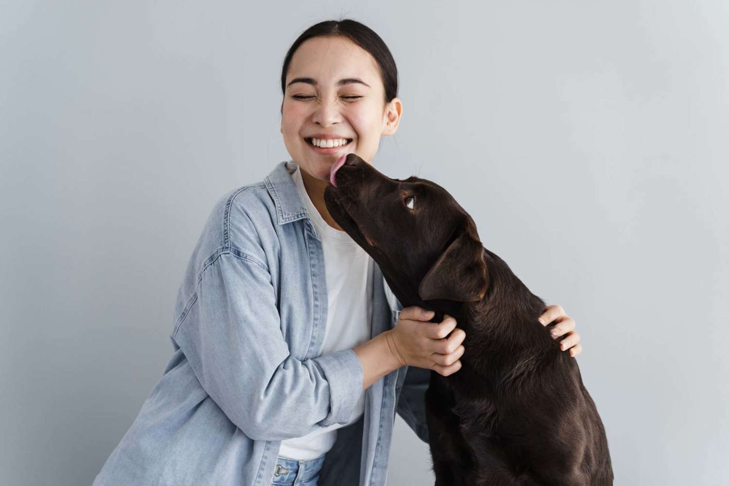 Resident playing with her dog at Arcos in San Antonio, Texas