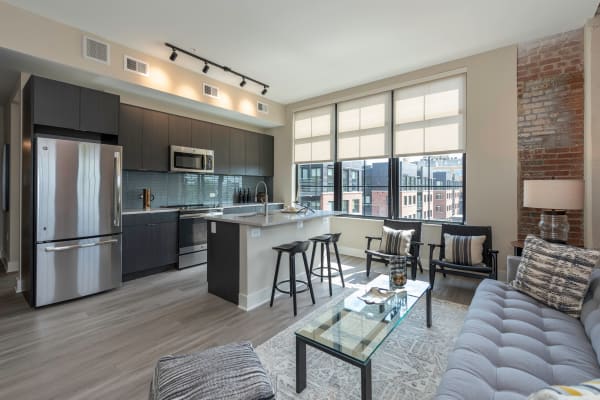 Spacious apartment with plank flooring and a kitchen island at Arcade Sunshine in Washington, District of Columbia
