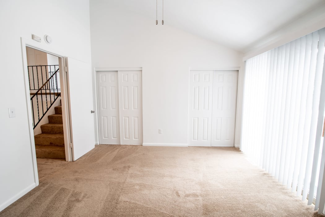 Naturally well-lit living room at Eagles Pointe Townhomes in Liverpool, NY
