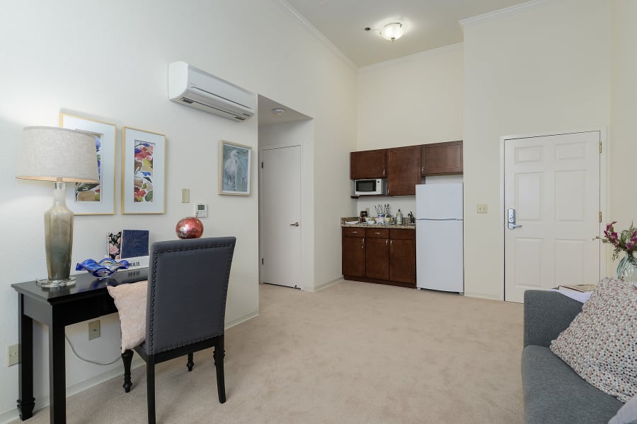 Living area and kitchen in suites at Palo Alto Commons in Palo Alto, California