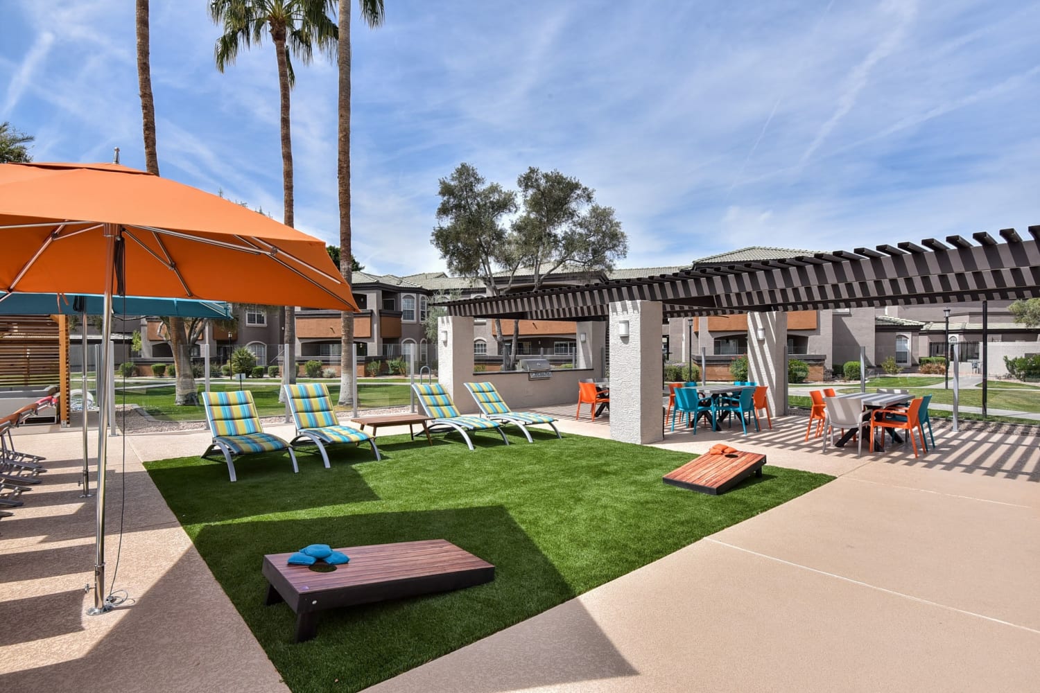 Outdoor patio and lawn games at Luxe @ Ocotillo in Chandler, Arizona