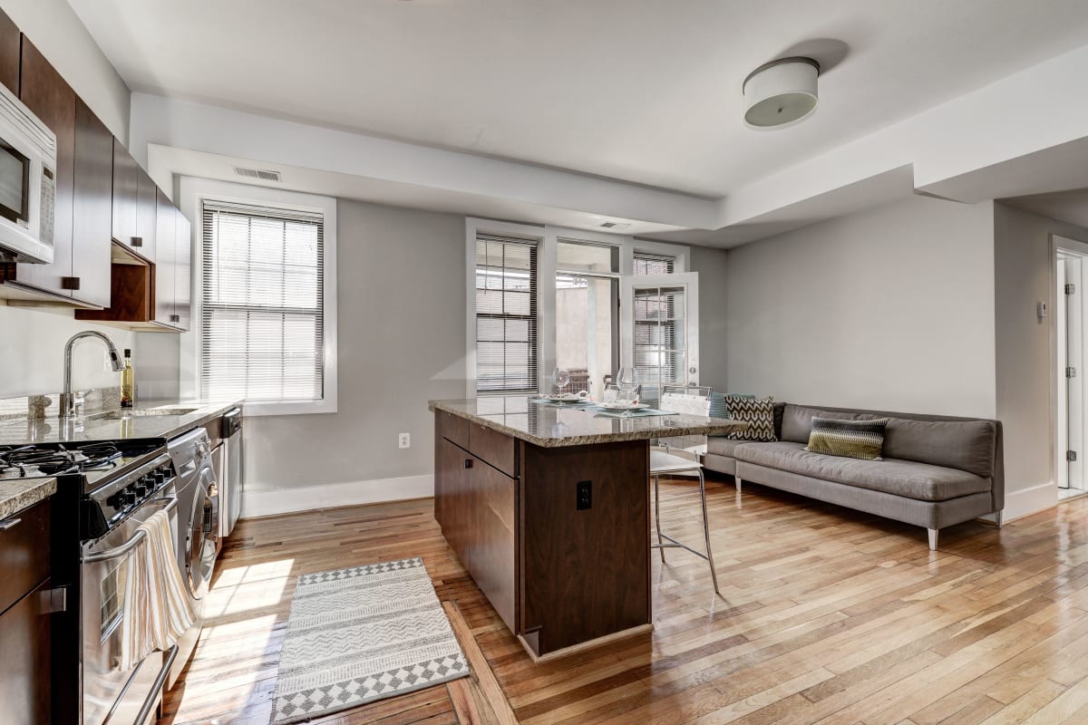 Open concept living area with a nice island for extra counter pace in the kitchen at Kenyon House in Washington, District of Columbia