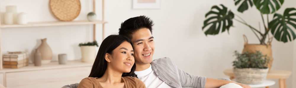 Happy couple in living room at Hayu Tilixam in Portland, Oregon