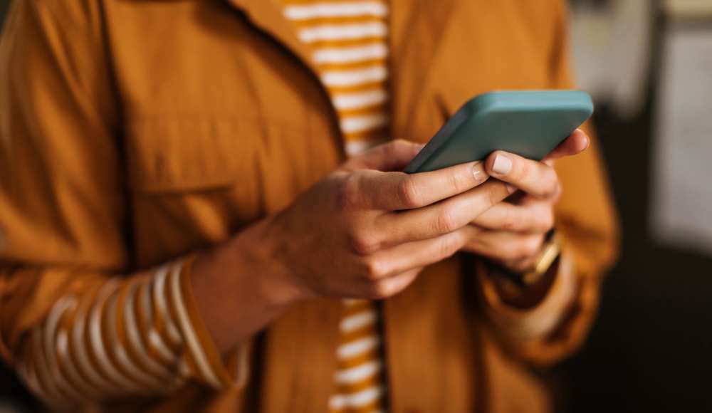 Resident using his mobile at Baywood Apartments in Gretna, Louisiana