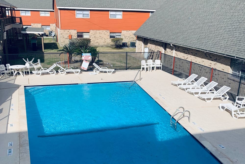 Resident swimming pool at Cambridge in the Groves in Groves, Texas