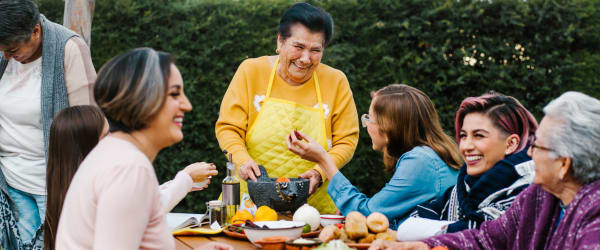 Residents eating together in the outdoor dining area at Lake Forest at Swift Creek in Midlothian, Virginia