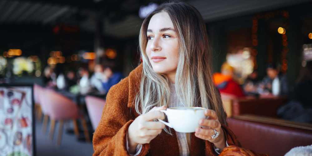 Woman having a cup of coffee near Villas at Fort Mill in Fort Mill, South Carolina