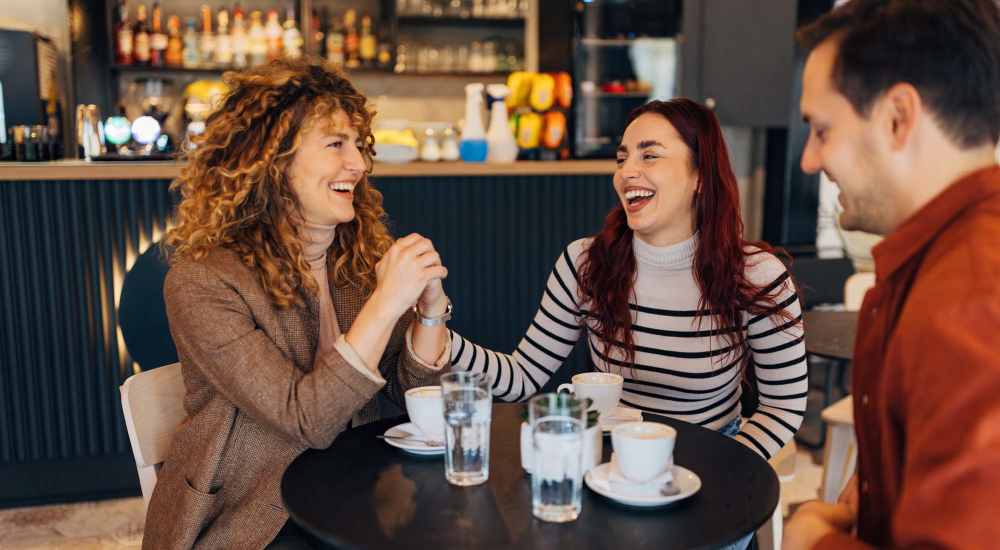 Friends having coffee in local cafe near Reserve South in Richmond, Virginia