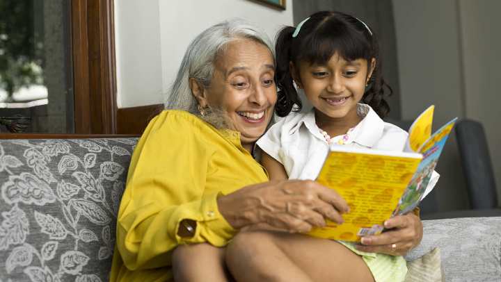 Grandma reading story to the kid