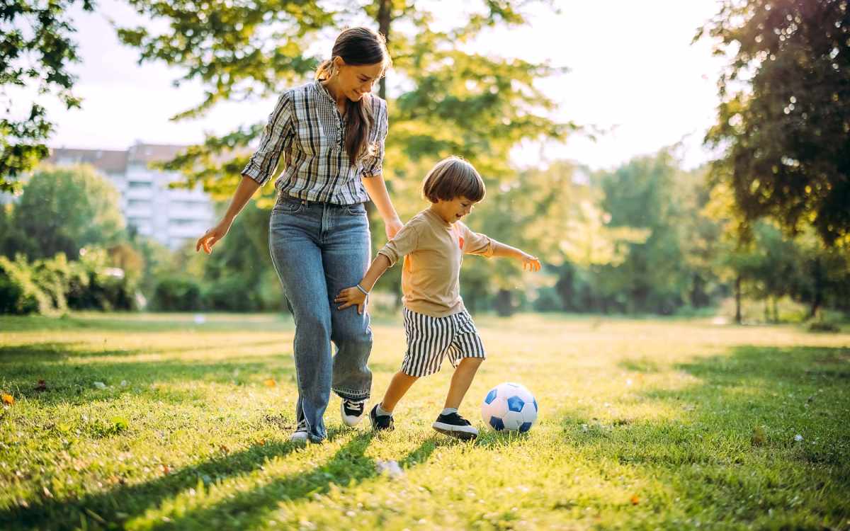 Resident women playing with her child at park near  Camas Meadows in Beaverton, Oregon