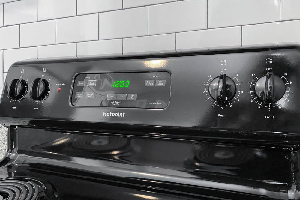 New Upgrades in Select Units: Subway Tile Backsplash, Energy Efficient Appliances Like This Black Oven/Electric Range The Hills at Oakwood Apartment Homes in Chattanooga, Tennessee