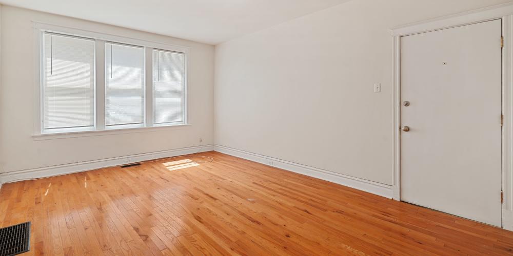 Unfurnished living room with hardwood flooring at Central West End Apartments in Saint Louis, Missouri