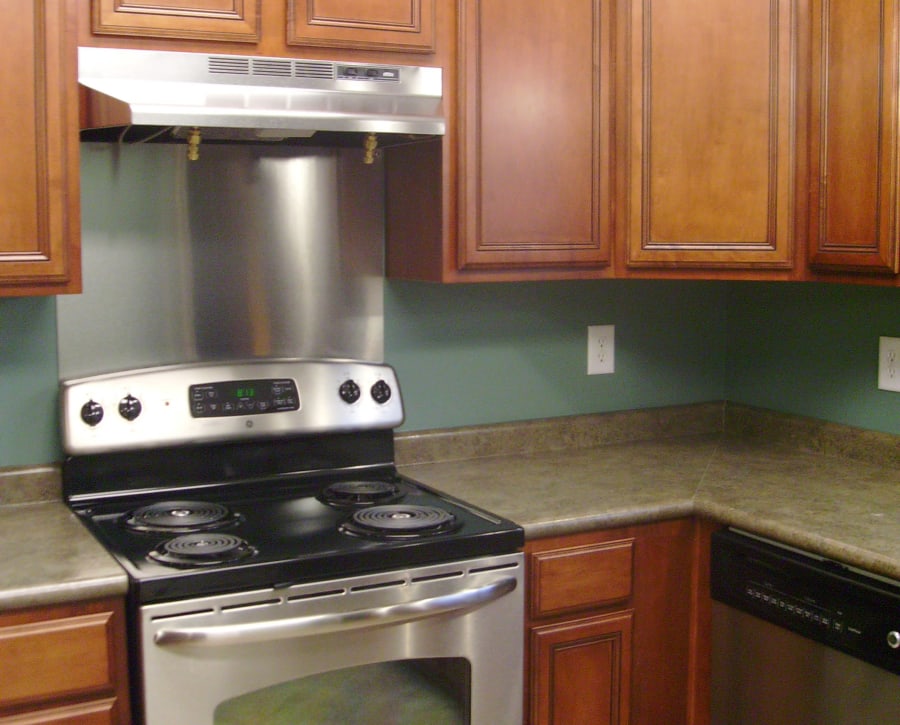 Modern kitchen with stainless-steel appliances in a model home at Azalea Springs in Marietta, Georgia