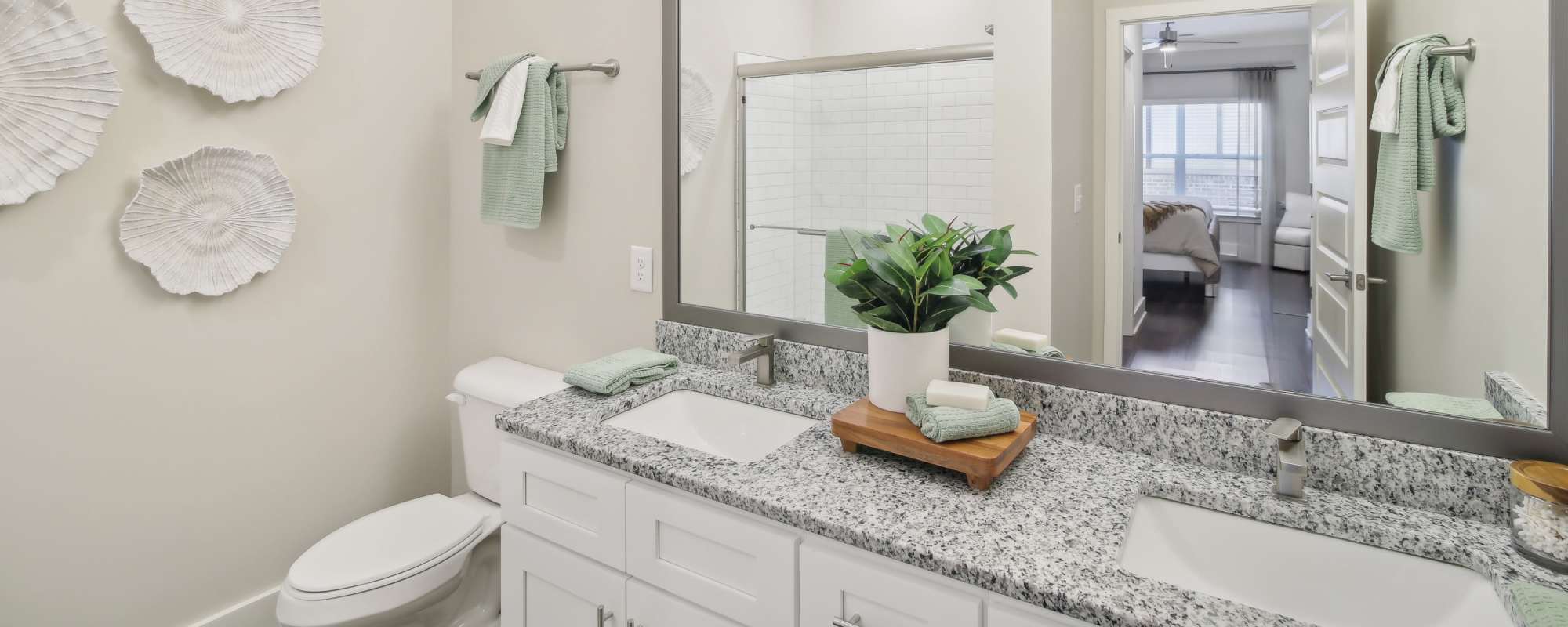 Bathroom with tiled tub/shower combination and granite vanity at Somerset in McDonough, Georgia