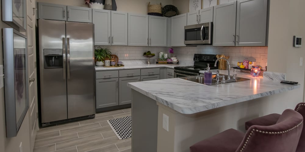 Beautiful new kitchen with breakfast bar at Artisan Crossing in Norman, Oklahoma