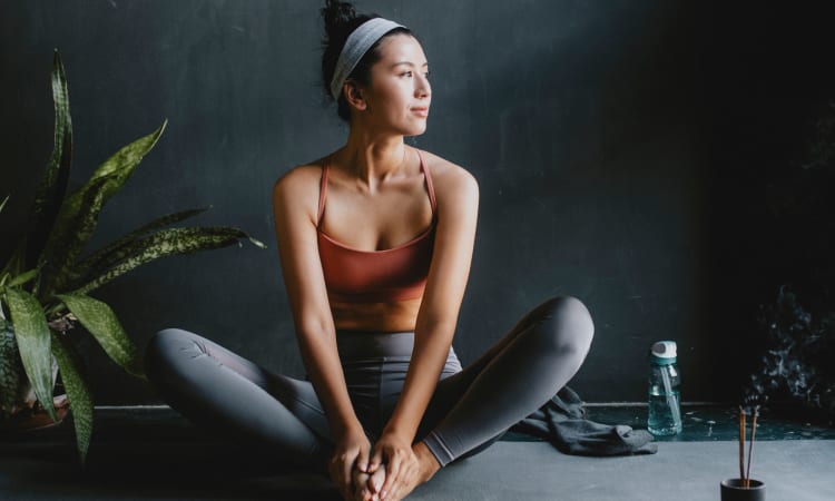 Resident doing yoga at home at Innova in Novi, Michigan