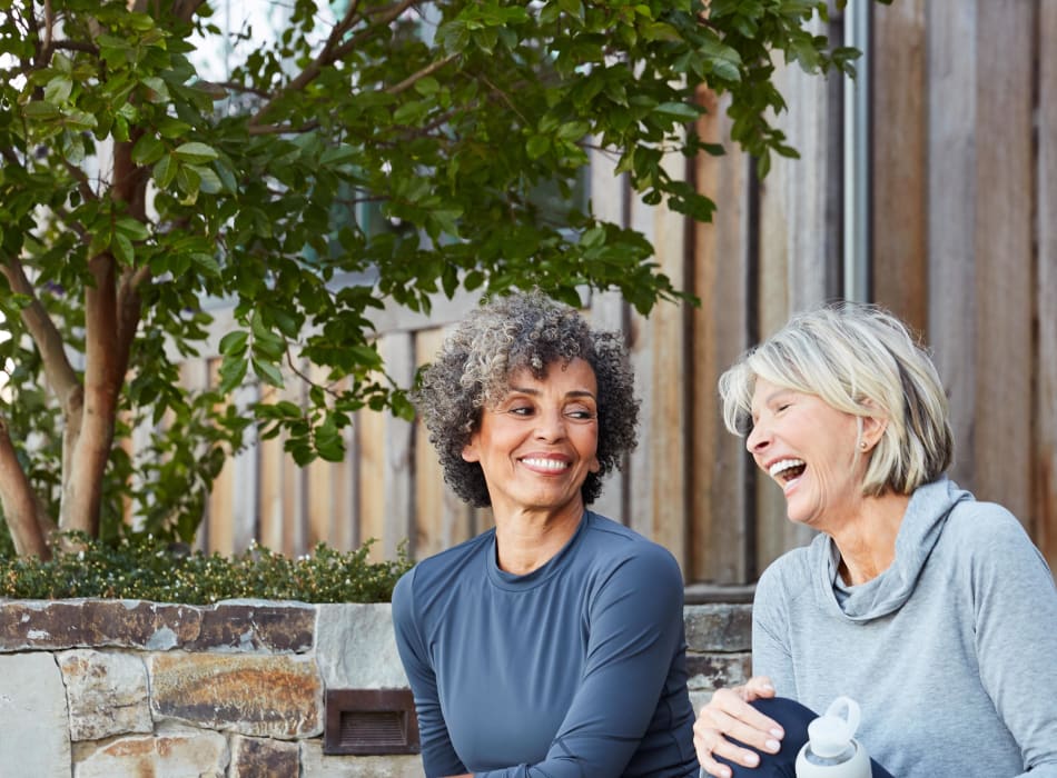 Residents sitting outside in front of their home enjoying the nice weather near Sofi Lyndhurst in Lyndhurst, New Jersey