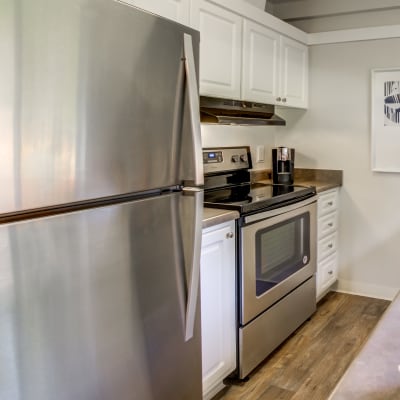 Modern kitchen with stainless-steel appliances in a model home at Sofi Fremont in Fremont, California