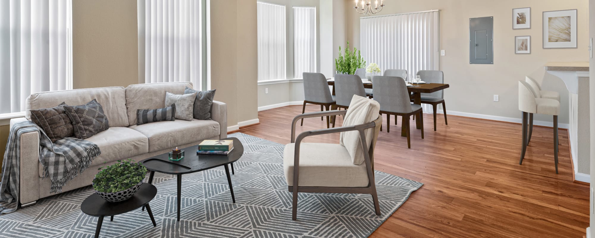 View of the living room and dining room in a home at The Village at Carolina Meadows in Chesapeake, Virginia